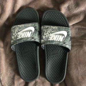 Grey Nike slides